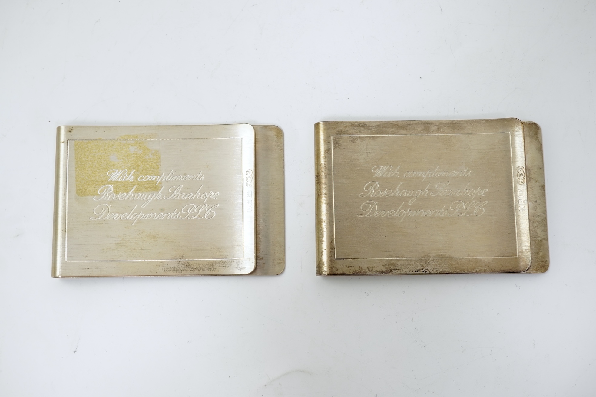 A pair of Elizabeth II silver money clips by Adrian Gerald Benney